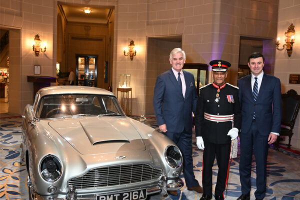 Peter Germain, Sir Ken Olisa and the RAC Secretary & Chief Executive Daniel Pereira with the James Bond DB5 Aston Martin